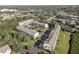 An aerial view showcases a well-maintained condo community with lush landscaping and a sparkling pool at 29 Seagrape Cir, Clearwater, FL 33759
