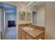 A bright bathroom featuring a vanity with a sink and a view into another room at 29 Seagrape Cir, Clearwater, FL 33759