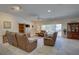 Spacious living room with comfortable leather seating and natural light at 29 Seagrape Cir, Clearwater, FL 33759