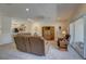 Open-concept living room with modern decor and access to the kitchen at 29 Seagrape Cir, Clearwater, FL 33759
