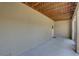 Screened patio with neutral walls and exposed ceiling at 29 Seagrape Cir, Clearwater, FL 33759