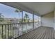 Charming screened porch overlooking the community pool and lush landscaping at 29 Seagrape Cir, Clearwater, FL 33759
