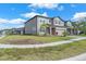 Beautiful two-story home with a well-maintained lawn and inviting curb appeal in a desirable neighborhood at 3113 Marine Grass Dr, Wimauma, FL 33598