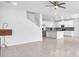 Open-concept living area showcases tile floors, neutral paint, and a modern kitchen at 3113 Marine Grass Dr, Wimauma, FL 33598