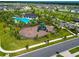 Aerial view of a playground and community pool, offering Gathering-friendly amenities and recreational spaces at 3113 Marine Grass Dr, Wimauma, FL 33598