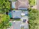 An aerial view shows the property's layout, including pools, parking, and landscaping at 3117 W Knights Ave, Tampa, FL 33611