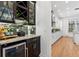 Modern bar area with wine storage and sleek countertops, perfect for entertaining at 3117 W Knights Ave, Tampa, FL 33611