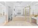 Bright bathroom featuring soaking tub, walk-in shower, and vanity, creating a spa-like retreat at 3117 W Knights Ave, Tampa, FL 33611
