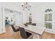 Bright dining room with modern table, chairs, and ample natural light at 3117 W Knights Ave, Tampa, FL 33611
