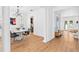 Bright dining room with marble-look dining table, modern chandelier, and wood-look floor at 3117 W Knights Ave, Tampa, FL 33611