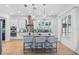 Modern kitchen with granite counters, stainless appliances, tile backsplash, and hardwood floors at 3117 W Knights Ave, Tampa, FL 33611