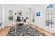 Bright, airy office with shuttered windows, a modern desk, and hardwood floors at 3117 W Knights Ave, Tampa, FL 33611