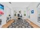 Bright office space with white walls, wood floors, area rug, and stylish modern desk at 3117 W Knights Ave, Tampa, FL 33611
