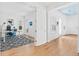Bright, airy office adjacent to hallway with hardwood floors and blue ceiling at 3117 W Knights Ave, Tampa, FL 33611