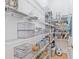 Well-organized pantry featuring metal shelving and clear storage containers, maximizing space and convenience at 3117 W Knights Ave, Tampa, FL 33611