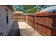 A fenced backyard with tile and brick, showing a clothesline at 342 N 40Th N St, St Petersburg, FL 33713