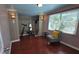 Comfortable bedroom featuring hard surface floors, modern lighting, and a large window at 342 N 40Th N St, St Petersburg, FL 33713