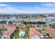Stunning aerial view of waterfront condos with boat docks and community pool overlooking the bay and intercoastal waterway at 350 Pinellas Bayway S # 7, Tierra Verde, FL 33715