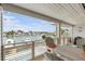 Inviting balcony with seating and a beautiful waterfront view with boat docks at 350 Pinellas Bayway S # 7, Tierra Verde, FL 33715