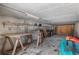 Spacious and unfinished basement with plenty of room for storage and projects, with a work bench and a kayak at 350 Pinellas Bayway S # 7, Tierra Verde, FL 33715