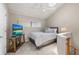 Upstairs bedroom with sloped ceilings features a comfortable bed and a wall-mounted television at 350 Pinellas Bayway S # 7, Tierra Verde, FL 33715