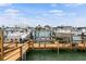 Private boat dock featuring boat lifts and a waterfront view at 350 Pinellas Bayway S # 7, Tierra Verde, FL 33715