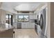 Bright kitchen with modern appliances and bar seating area at 350 Pinellas Bayway S # 7, Tierra Verde, FL 33715