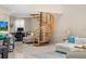 Bright living space featuring a spiral staircase and a comfortable seating area with modern furnishings at 350 Pinellas Bayway S # 7, Tierra Verde, FL 33715