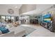 Inviting living room with large windows and modern furnishings at 350 Pinellas Bayway S # 7, Tierra Verde, FL 33715