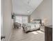 Tranquil main bedroom suite features a comfortable bed, soft lighting, and wood-look flooring at 350 Pinellas Bayway S # 7, Tierra Verde, FL 33715