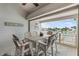 Waterfront patio with seating area offers stunning views of the canal and access to outdoor living at 350 Pinellas Bayway S # 7, Tierra Verde, FL 33715