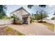Exterior shot of a paved backyard featuring a screened-in porch at 3615 S Church Ave, Tampa, FL 33629