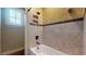 Tiled tub with window and tiled walls at 3615 S Church Ave, Tampa, FL 33629