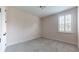This is a small bedroom with one window and light pink walls at 3615 S Church Ave, Tampa, FL 33629