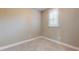 Bedroom with a window and neutral carpet at 3615 S Church Ave, Tampa, FL 33629