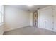 Neutral carpeted bedroom features a closet and bright, natural light from the window at 3615 S Church Ave, Tampa, FL 33629