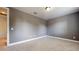 Comfortable bedroom features neutral gray walls and soft carpet flooring at 3615 S Church Ave, Tampa, FL 33629