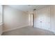 Neutral carpeted bedroom features a closet and bright, natural light from the window at 3615 S Church Ave, Tampa, FL 33629