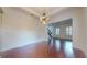 Inviting dining area showcasing hardwood floors, elegant lighting, and views of the staircase at 3615 S Church Ave, Tampa, FL 33629