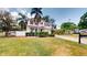 Two story home with a tile roof, paved driveway, and manicured landscaping at 3615 S Church Ave, Tampa, FL 33629