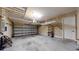 Spacious two car garage with overhead storage racks and storage shelving at 3615 S Church Ave, Tampa, FL 33629