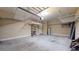 Spacious two car garage with overhead storage racks and storage shelving at 3615 S Church Ave, Tampa, FL 33629