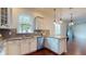 Bright kitchen with stainless steel appliances, granite counters, and plenty of natural light at 3615 S Church Ave, Tampa, FL 33629