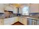 Stylish kitchen featuring granite countertops, subway tile backsplash, and stainless steel appliances at 3615 S Church Ave, Tampa, FL 33629