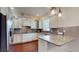 Well-appointed kitchen featuring white cabinetry, granite countertops, and stainless steel appliances at 3615 S Church Ave, Tampa, FL 33629
