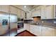 Modern kitchen featuring stainless steel appliances, granite countertops, and ample cabinet space at 3615 S Church Ave, Tampa, FL 33629