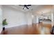 Bright living room with hardwood floors, recessed lights, and an adjacent modern kitchen at 3615 S Church Ave, Tampa, FL 33629