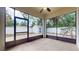 View from the screened-in porch, looking into the backyard and storage shed at 3615 S Church Ave, Tampa, FL 33629
