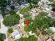 This is an aerial view of the home surrounded by lush trees in a cozy and established neighborhood at 3621 18Th N St, St Petersburg, FL 33713