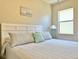 Comfortable bedroom features soft lighting and light, airy decor at 408 Delwood Breck St, Ruskin, FL 33570